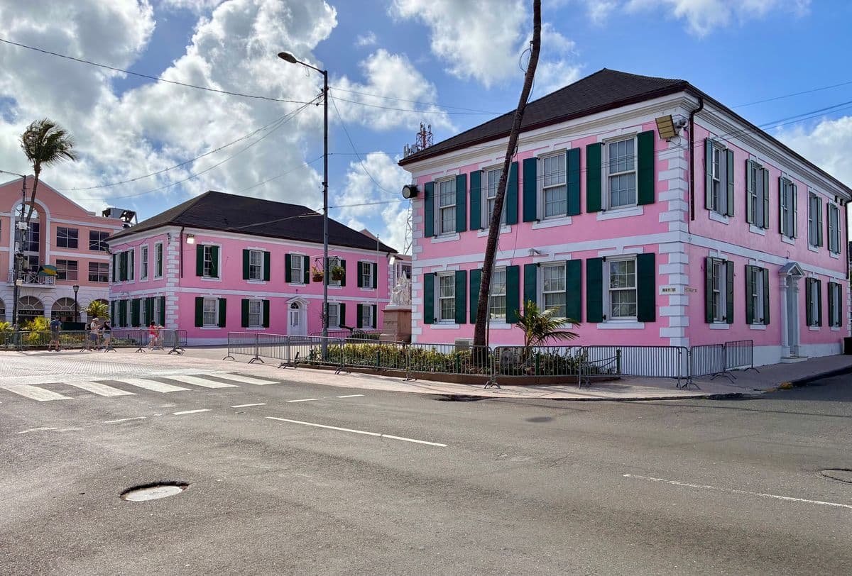 Pink colonial government buildings with green shutters, Downtown Nassau